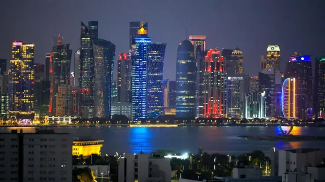 An image of the Doha skyline illuminated at night