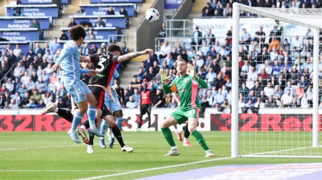 Tatsuhiro Sakamoto heads towards goal