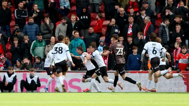 Adam Randall runs off to celebrate
