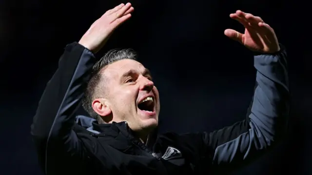 Matt Bloomfield raises his hands in celebration