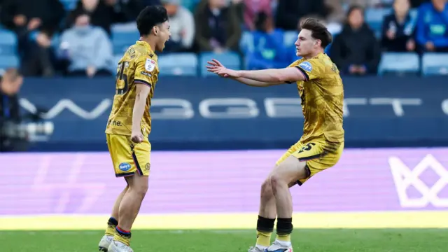 Ryoya Morishita and Taylor Gardner-Hickman celebrate after beating Millwall