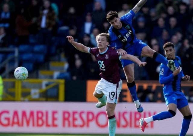 Burnley's Zian Flemming and Bournemouth's Marcos Senesi battle for the ball