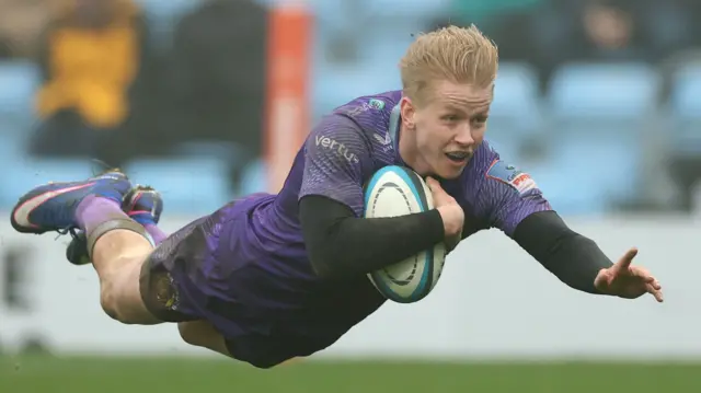 Exeter's Josh Hodge dives to score a try against Northampton Saints