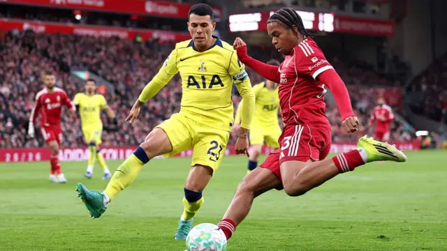 Rio Ngumoha and Pedro Porro fight for the ball