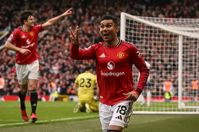 Casemiro (R) celebrates