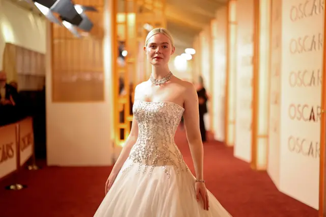 Elle Fanning poses for a photo