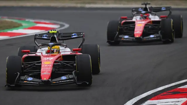 Lewis Hamilton in front of Charles Leclerc out on the circuit