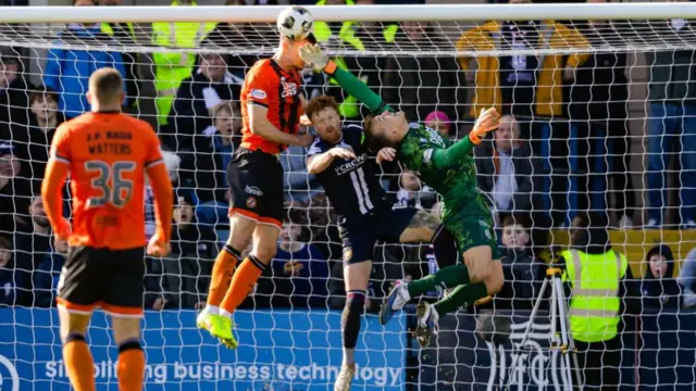 Dundee United's Ashley Maynerd-Brewer clears the danger