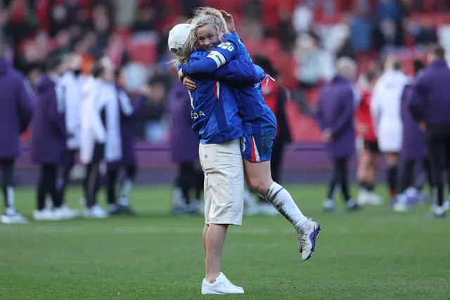 Chelsea's English defender #04 Millie Bright (L) runs on to celebrate with Chelsea's Scottish midfielder #08 Erin Cuthbert