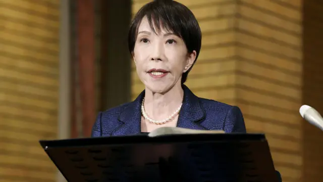 Sanae Takaichi speaks to media at her residence in Tokyo on 11 March