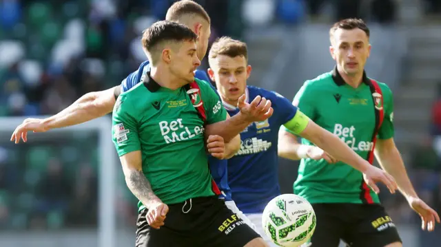 Action from Glentoran v Linfield