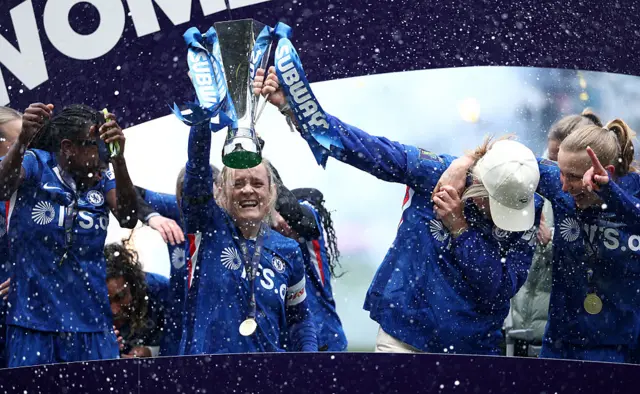Players of Chelsea pose for a photo with the Subway Women's League Cup trophy