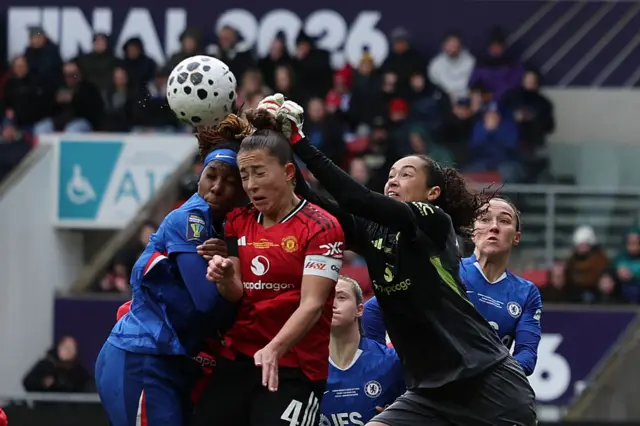 Manchester United's US goalkeeper Phallon Tullis-Joyce punches the ball clear