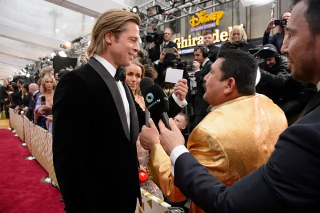 Brad Pitt talking to reporters