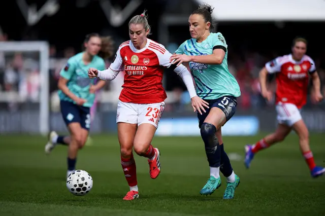 Alessia Russo of Arsenal is challenged by Teyah Goldie of London City Lionesses