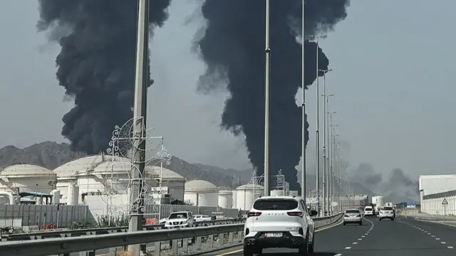 Smoke rises from the direction of an energy installation in the Gulf emirate of Fujairah, two large dark plumes.