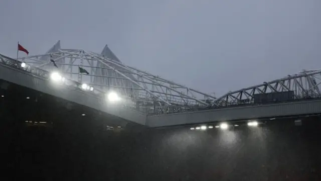 General view inside the stadium, as heavy rain falls