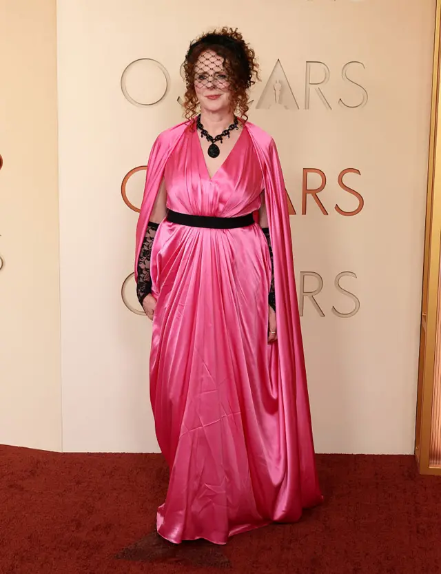 Maggie O'Farrell in a long, pink silk dress