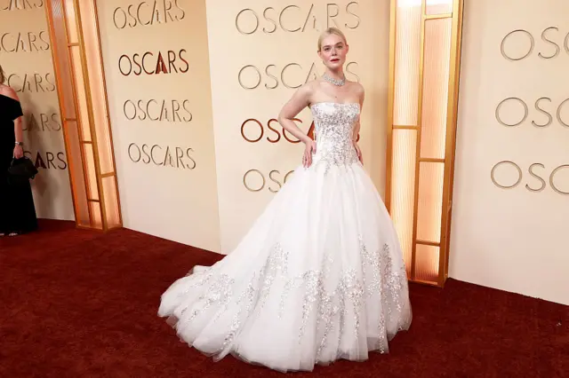 Elle Fanning in a floor-length white gown