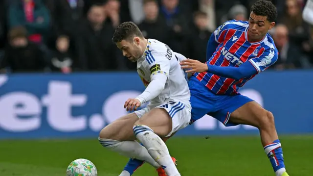 Gabriel Gudmundsson vies with Brennan Johnson
