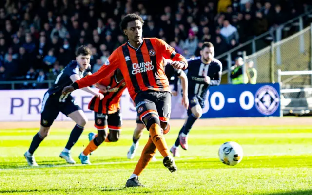 Dundee United's Amar Fatah scores