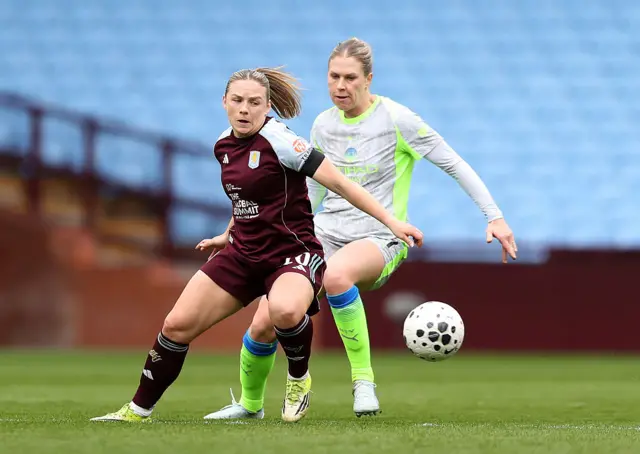 Kirsty Hanson of Aston Villa is put under pressure by Rebecca Knaak of Manchester City