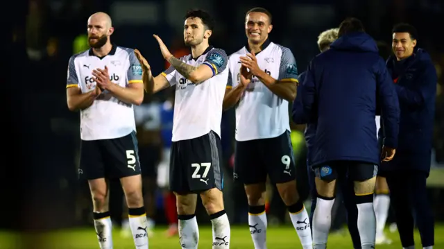Derby players celebrate at full-time at Fratton Park