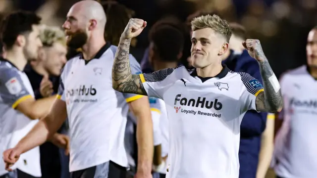 Sam Szmodics celebrates