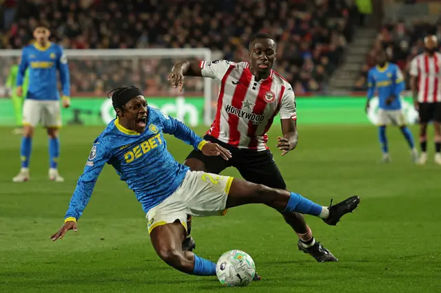 Wolverhampton Wanderers' French midfielder #27 Jean-Ricner Bellegarde is fouled by Brentford's Italian defender #33 Michael Kayode