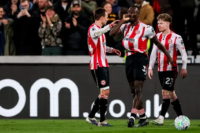 Michael Kayode of Brentford celebrates
