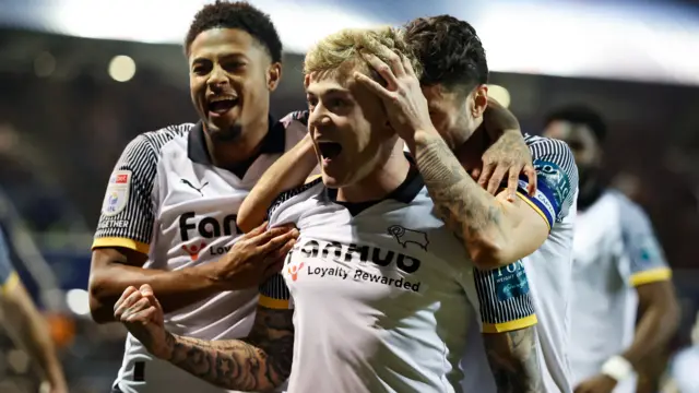Derby players celebrate