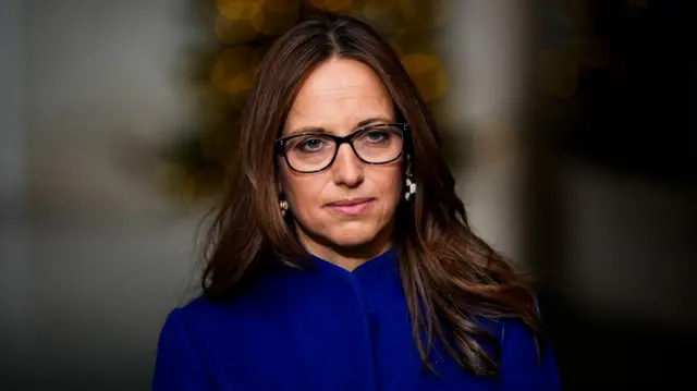A headshot of Helen Whately against a blurred background