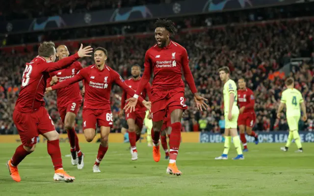 Divock Origi celebrates as Liverpool score to seal 4-0 win over Barcelona and a 4-3 victory on aggregate