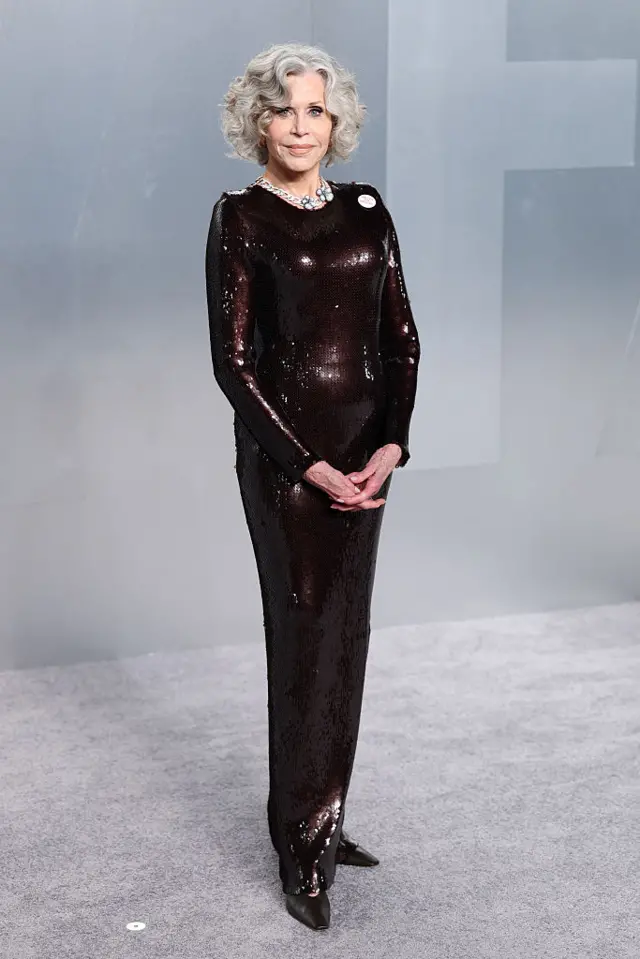 Jane Fonda in a long black dress