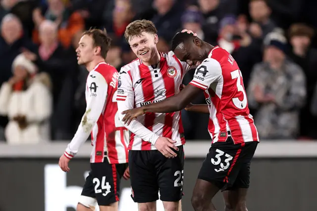 Michael Kayode of Brentford celebrates scoring his team's first goal