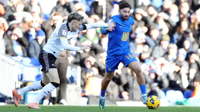 Birmingham's Patrick Roberts dribbles away from Derby's Bobby Clark