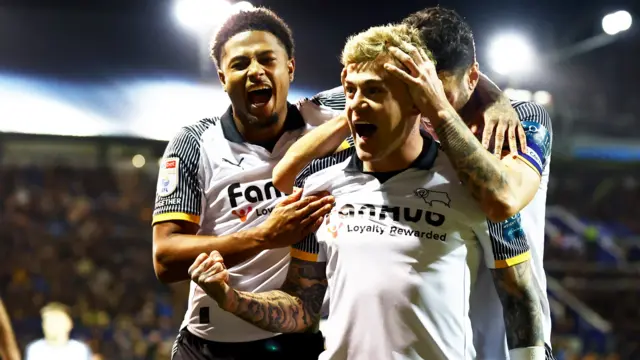 Derby players celebrate