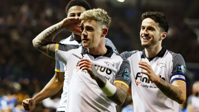 Sam Szmodics celebrates