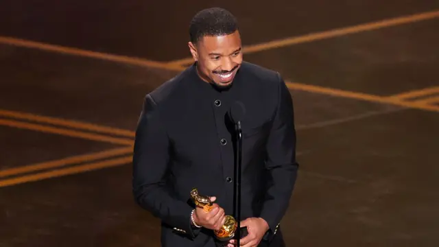Michael B Jordan collecting his Oscar