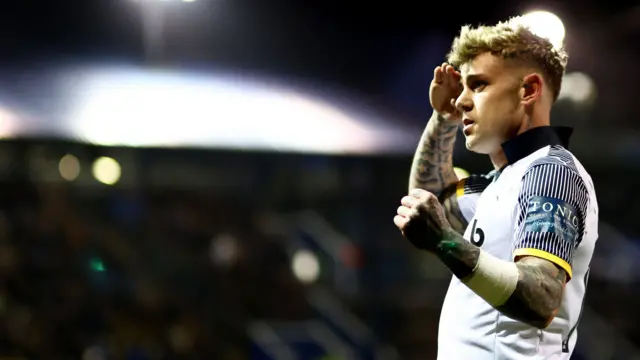 Sam Szmodics celebrates