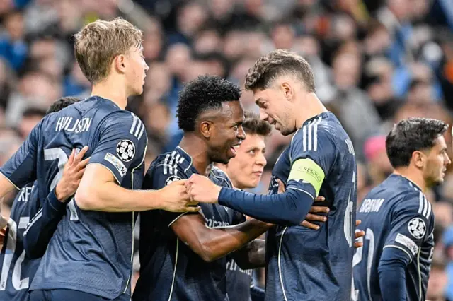 Vinicius Junior of Real Madrid CF celebrate with team-mates