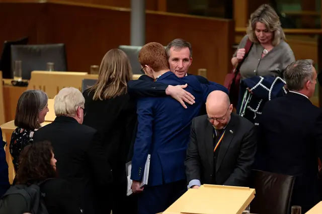 Ross Greer hugs Liam McArthur