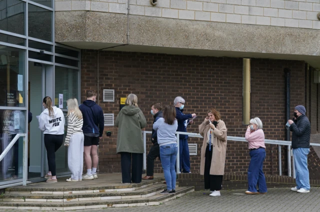 Students queuing for antibiotics outside a building at the University of Kent in Canterbury.
