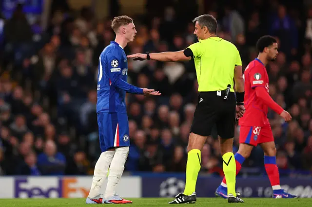 Cole Palmer of Chelsea complains to referee Slavko Vincic
