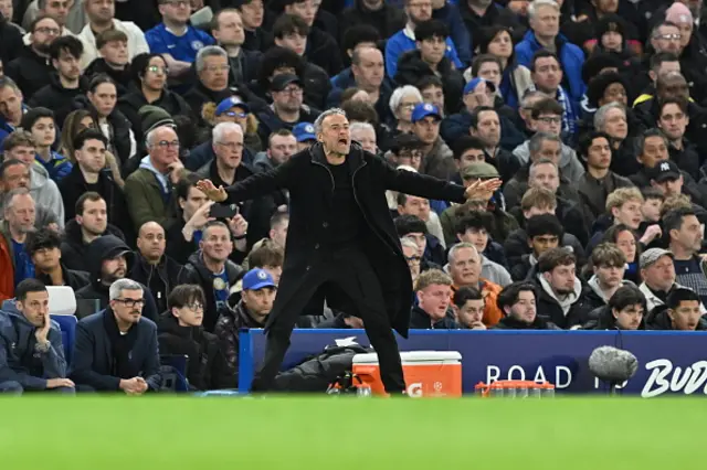 Head coach Luis Enrique of Paris Saint-Germain gives tactics to his players