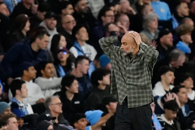 Pep Guardiola head coach of Manchester City and Spain dejected