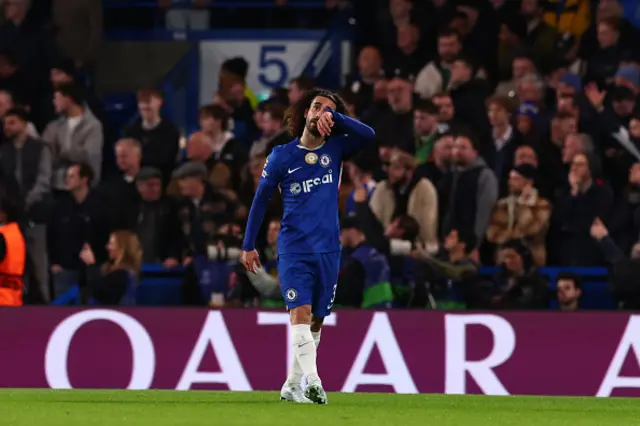 A dejected Marc Cucurella looks on