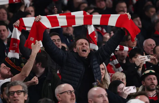 An Arsenal fan shows support