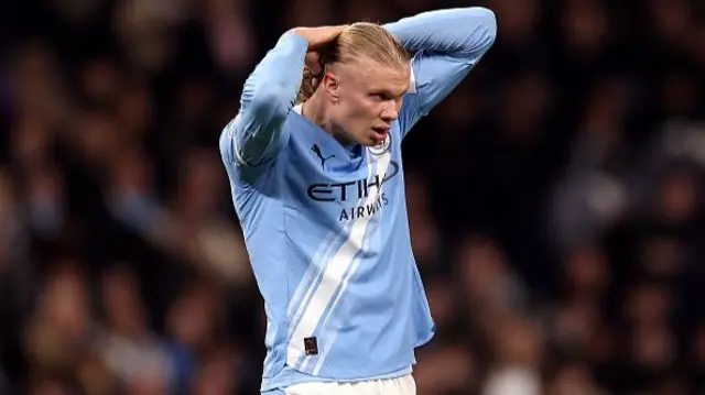 Erling Haaland of Manchester City looks dejected