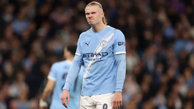Erling Haaland of Manchester City looks dejected
